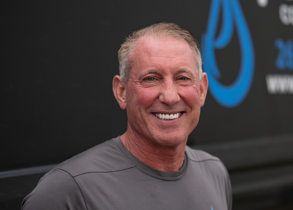 Paul headshot, standing in front of black work truck